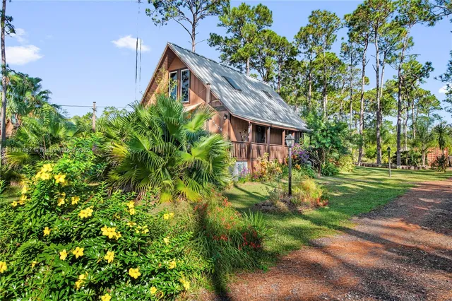 a backyard of a house with lots of green space