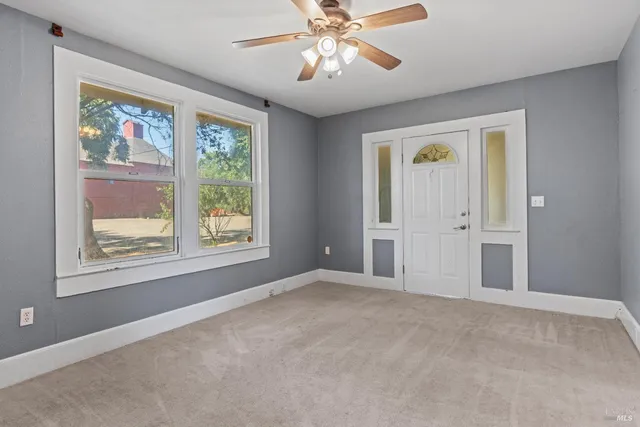 a view of an empty room with a window