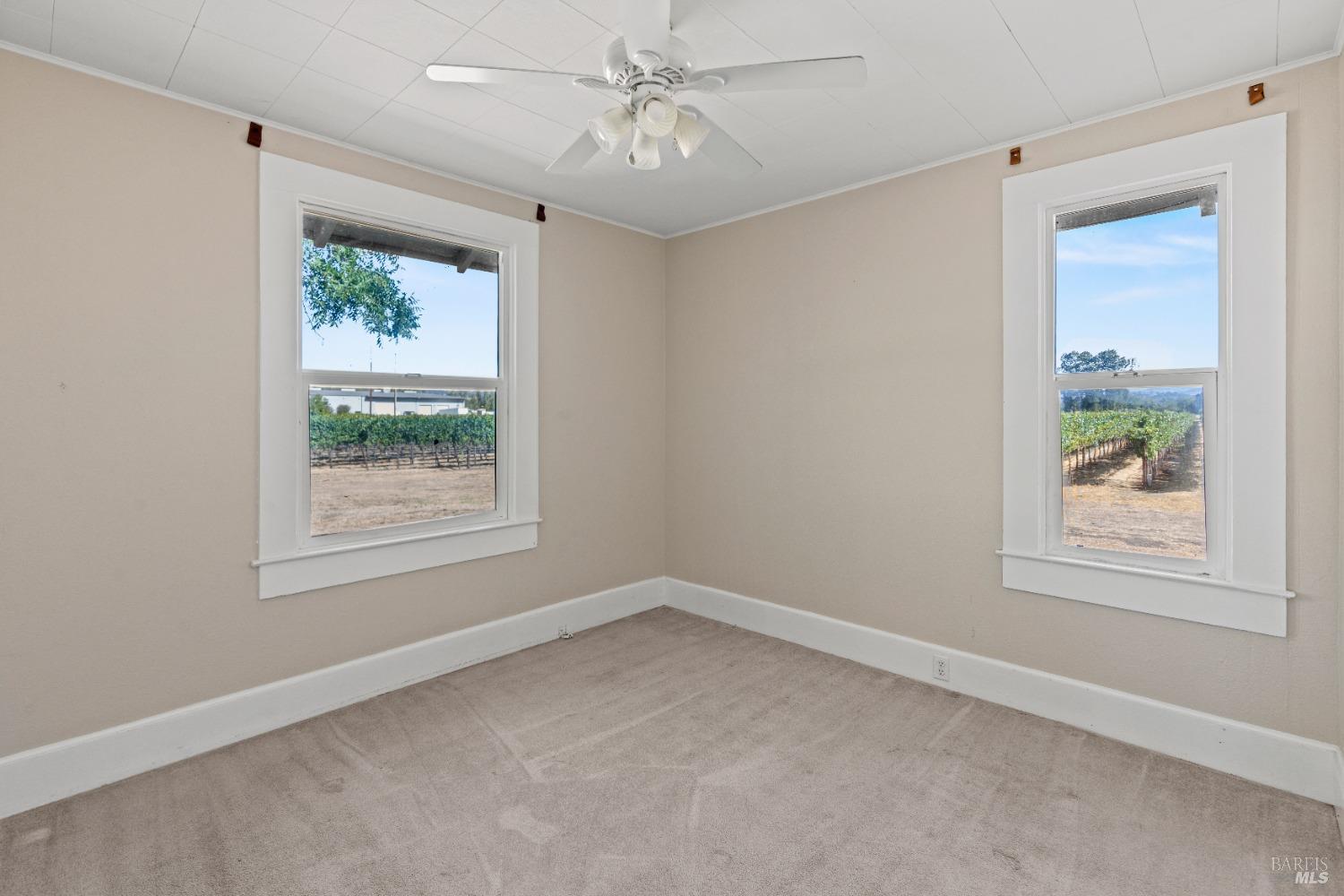700 Ford Road Ukiah, CA 95482 - Photo 16 of 37 an empty room with a window and a ceiling fan