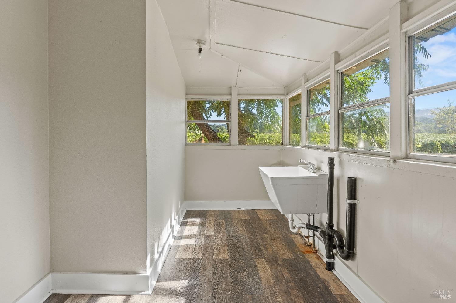 700 Ford Road Ukiah, CA 95482 - Photo 19 of 37 a view of a room with wooden floor and windows