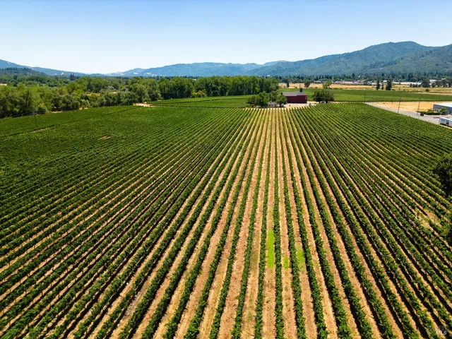 a view of a balcony with wooden floor and lake view