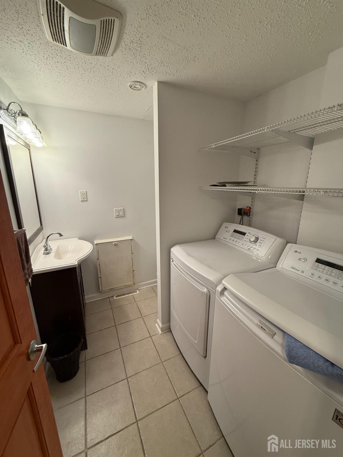 109 John Street Helmetta, NJ 08828 - Photo 12 of 18 a utility room with dryer and washer