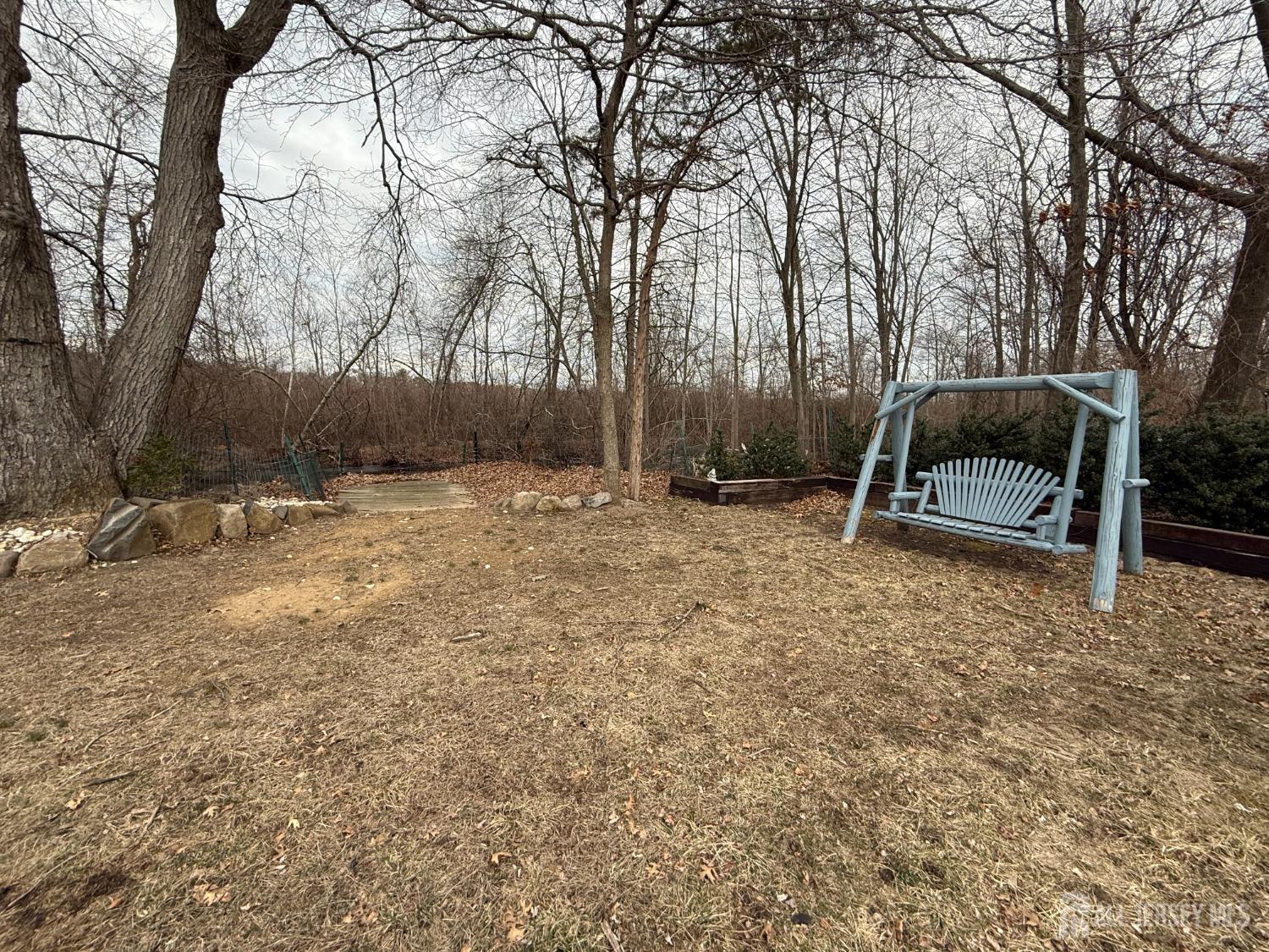 109 John Street Helmetta, NJ 08828 - Photo 16 of 18 a backyard of a house with lots of green space