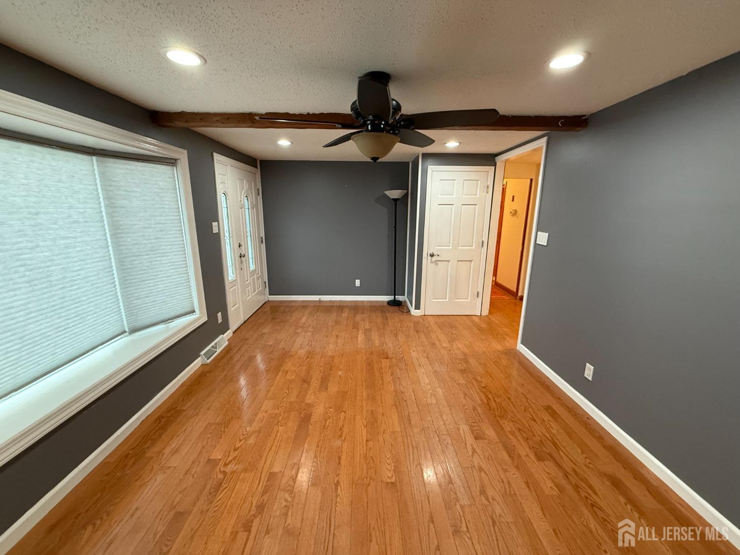 109 John Street Helmetta, NJ 08828 - Photo 3 of 18 a view of empty room with wooden floor