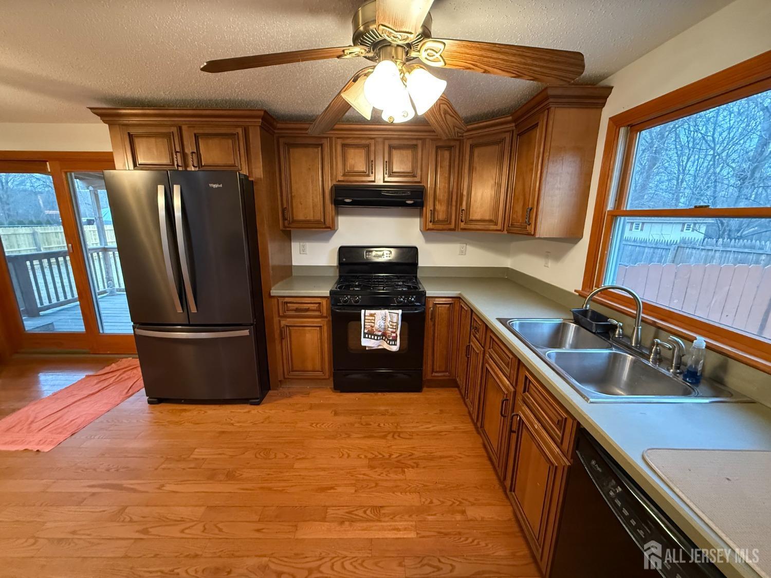 109 John Street Helmetta, NJ 08828 - Photo 5 of 18 a kitchen with stainless steel appliances granite countertop a refrigerator a sink a stove and dishwasher