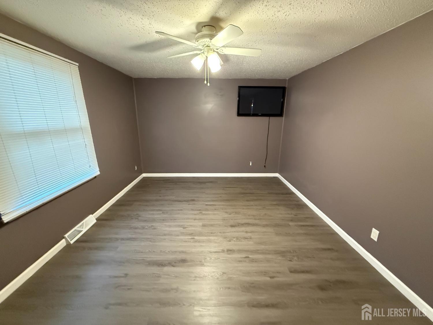 109 John Street Helmetta, NJ 08828 - Photo 6 of 18 a view of an empty room with a window