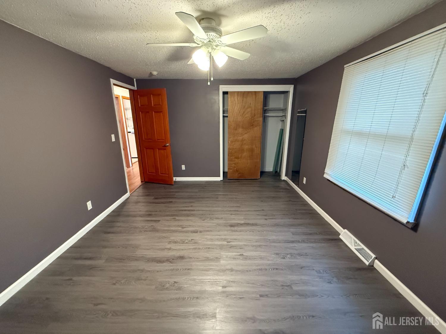 109 John Street Helmetta, NJ 08828 - Photo 7 of 18 a view of an empty room with closet and a window