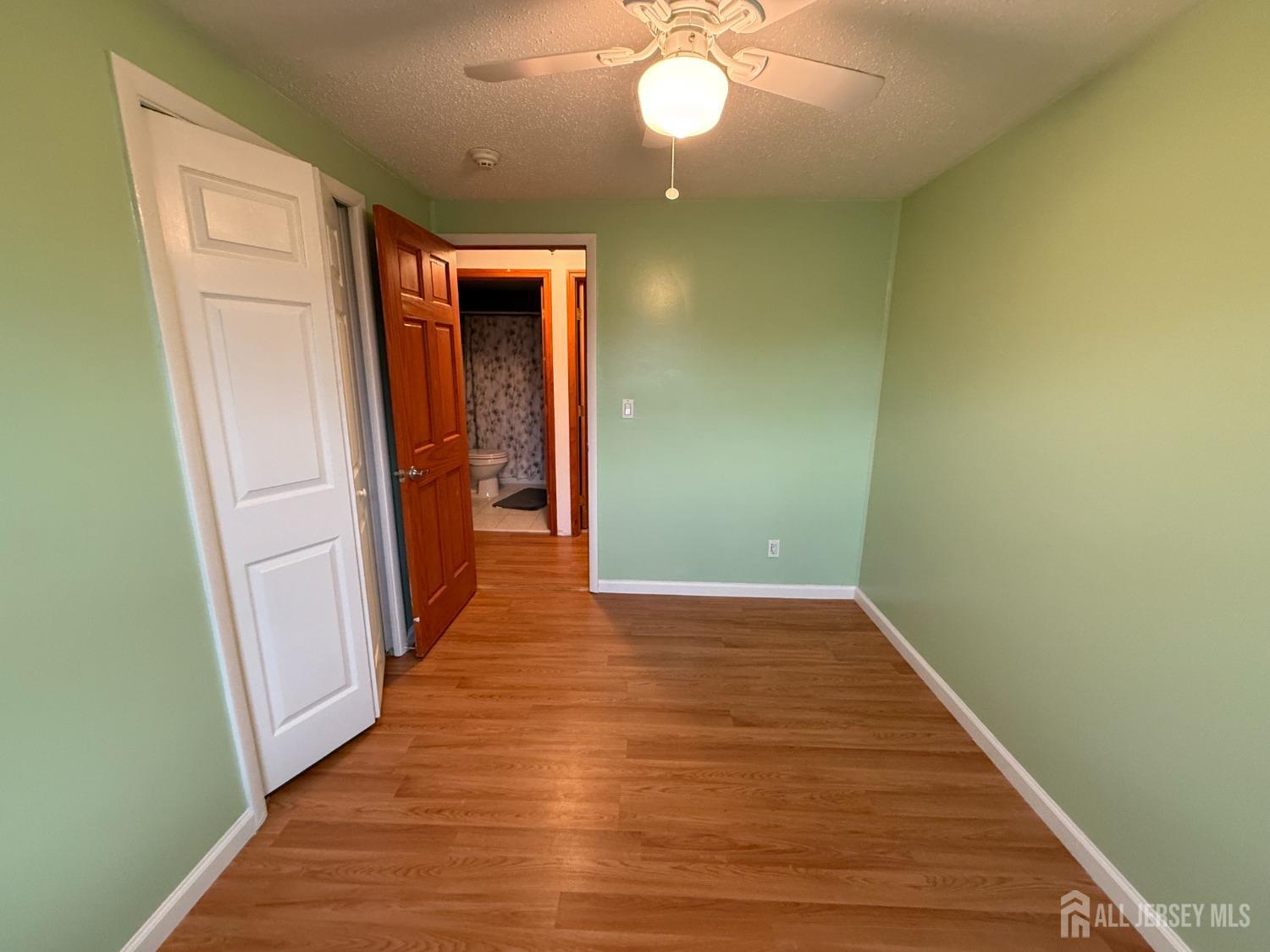 109 John Street Helmetta, NJ 08828 - Photo 9 of 18 a view of a hallway with wooden floor