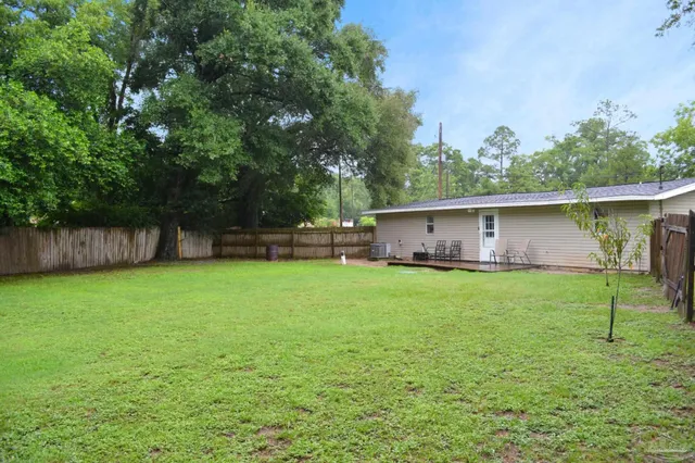 swimming pool view with a seating space