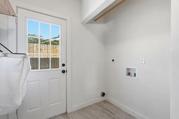 a outdoor living space with patio furniture and wooden floor
