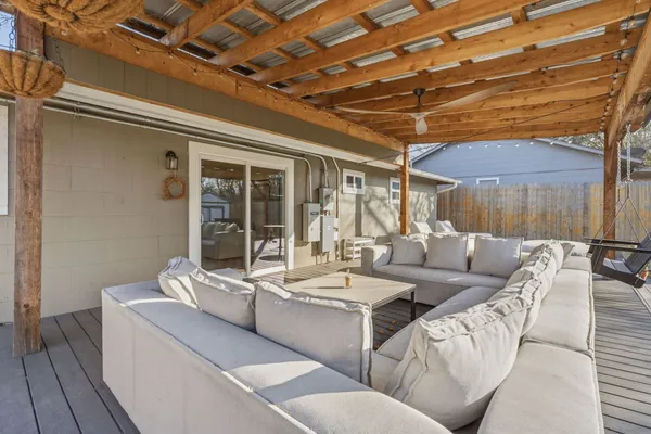 a view of a backyard with sitting area