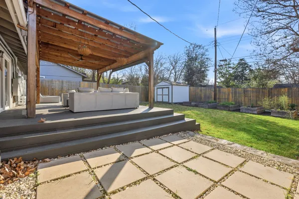 a view of a house with backyard and porch