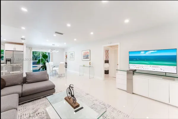 a living room with furniture and a table