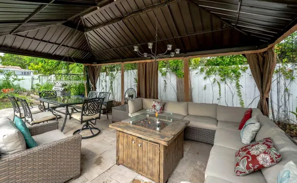 a outdoor living space with furniture and garden view