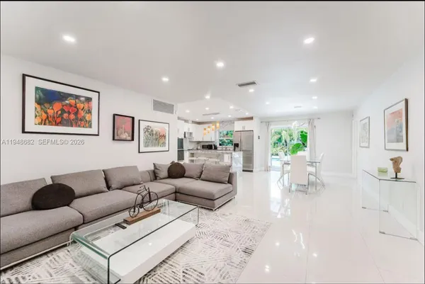 a living room with furniture and a large window