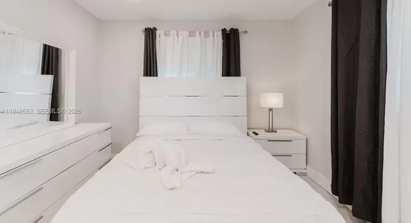 a bathroom with a bathtub sink and toilet