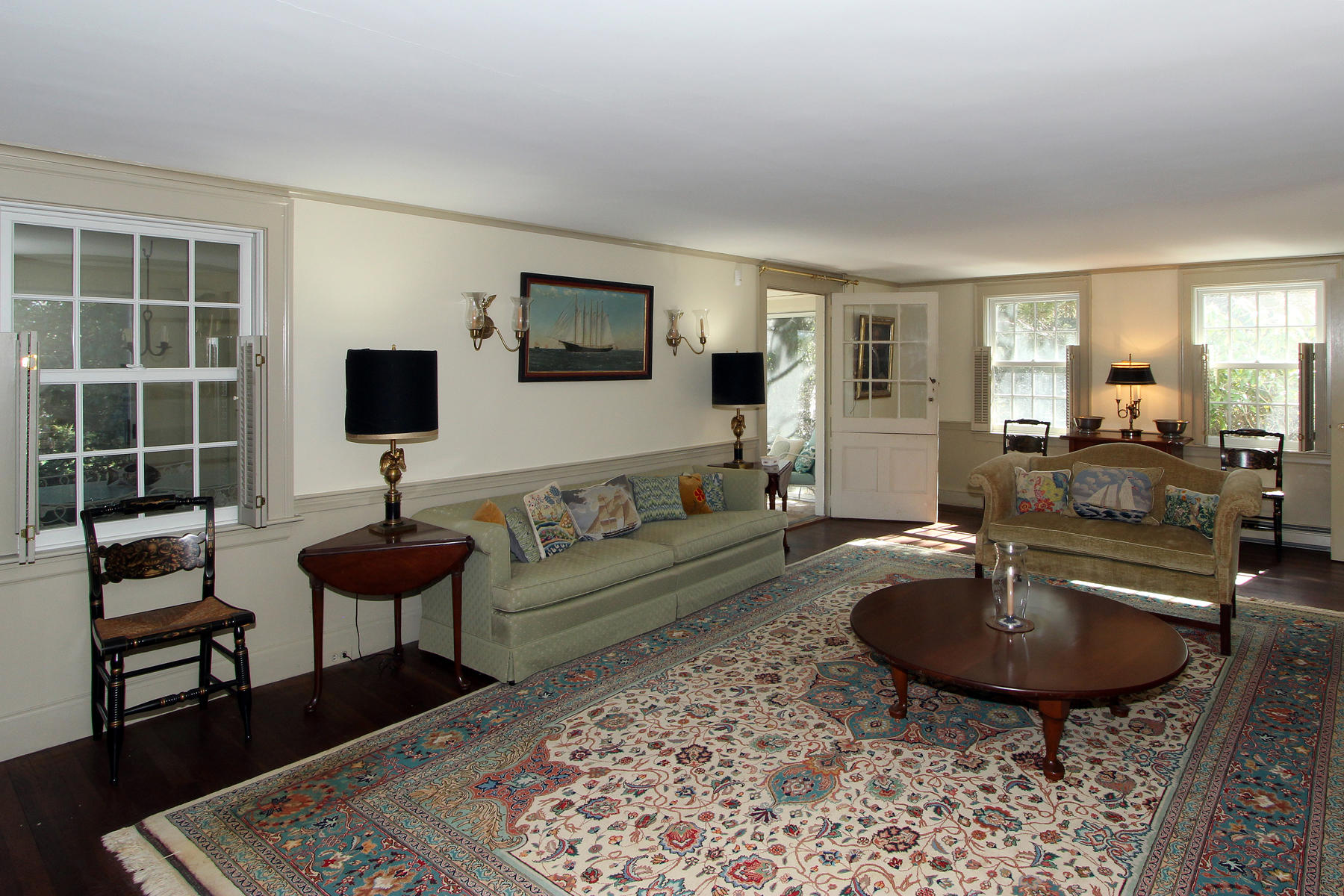 163 Pochet Road Orleans, MA 02653 - Photo 13 of 67 a living room with furniture a rug and a flat screen tv