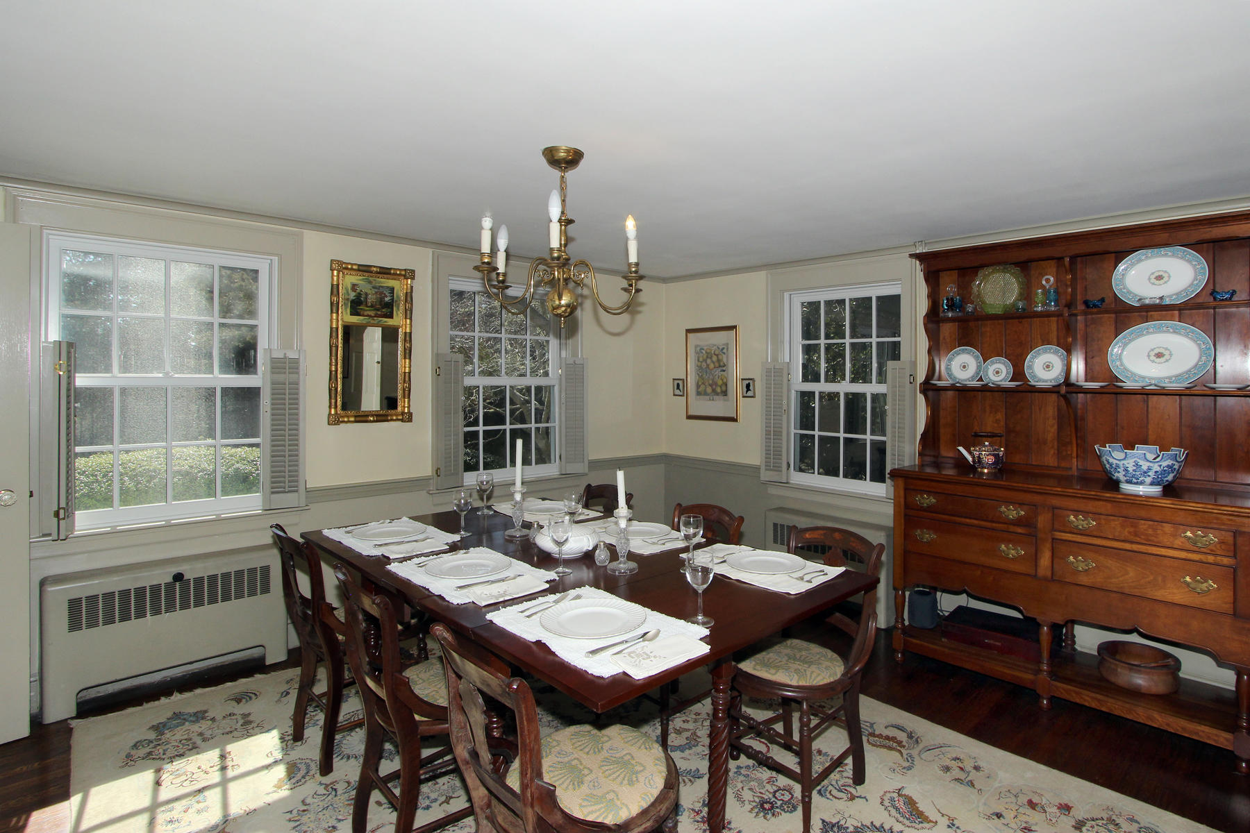 163 Pochet Road Orleans, MA 02653 - Photo 16 of 67 a view of a dining room with furniture and chandelier