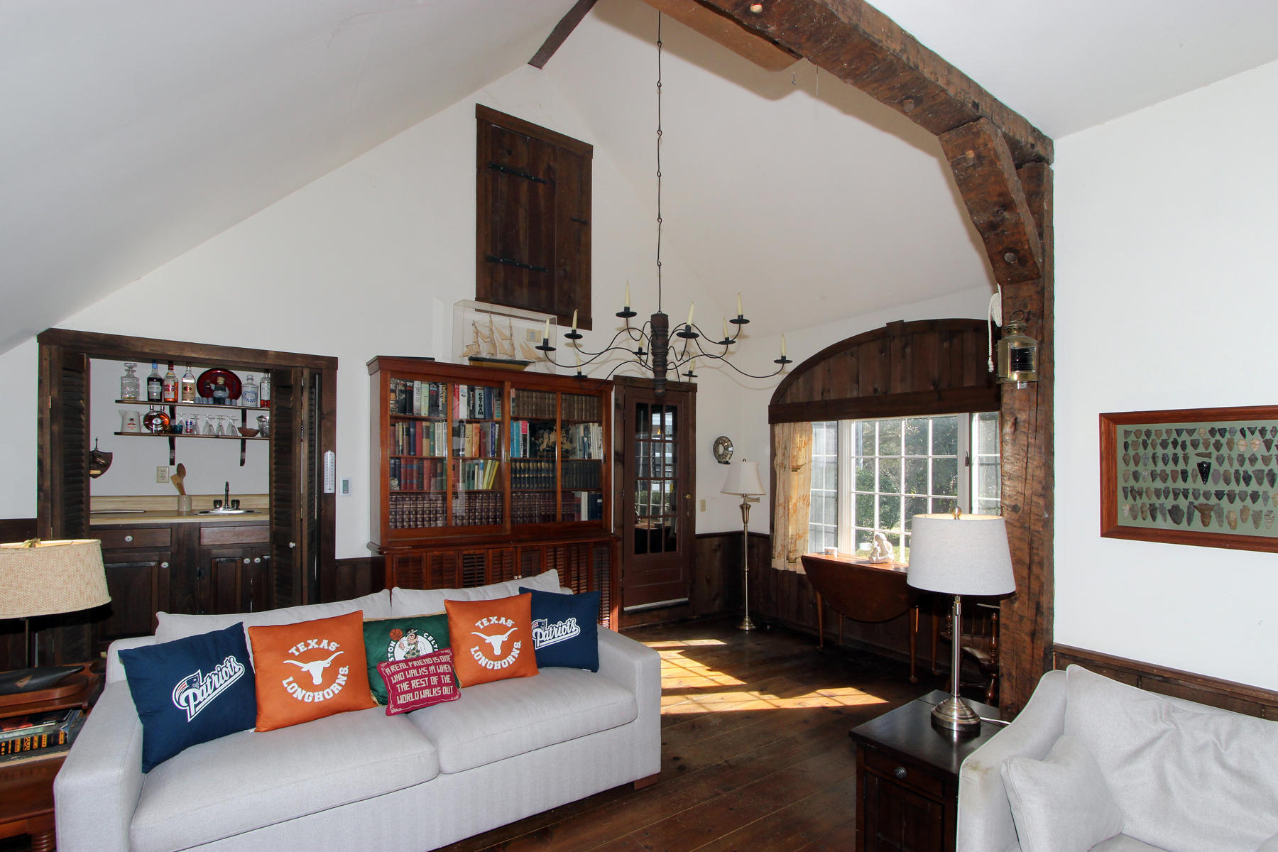 163 Pochet Road Orleans, MA 02653 - Photo 25 of 67 a living room with furniture and a window