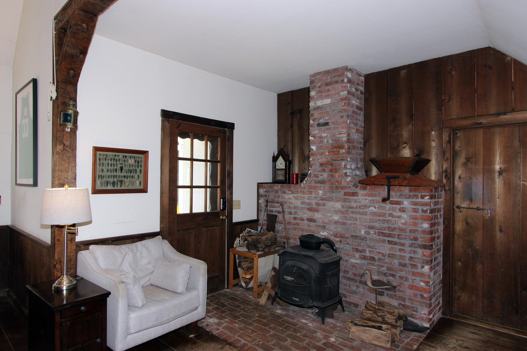 163 Pochet Road Orleans, MA 02653 - Photo 27 of 67 a living room with furniture and a fireplace