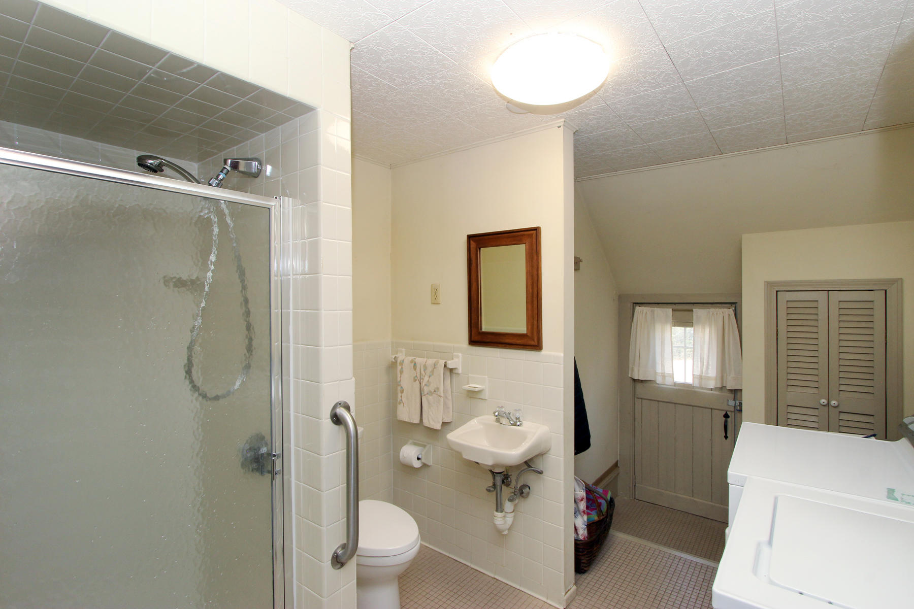 163 Pochet Road Orleans, MA 02653 - Photo 29 of 67 a bathroom with a toilet sink and shower