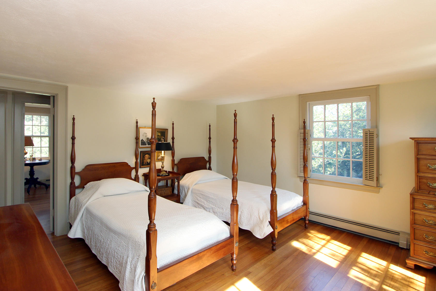 163 Pochet Road Orleans, MA 02653 - Photo 36 of 67 a spacious bedroom with two beds and a window