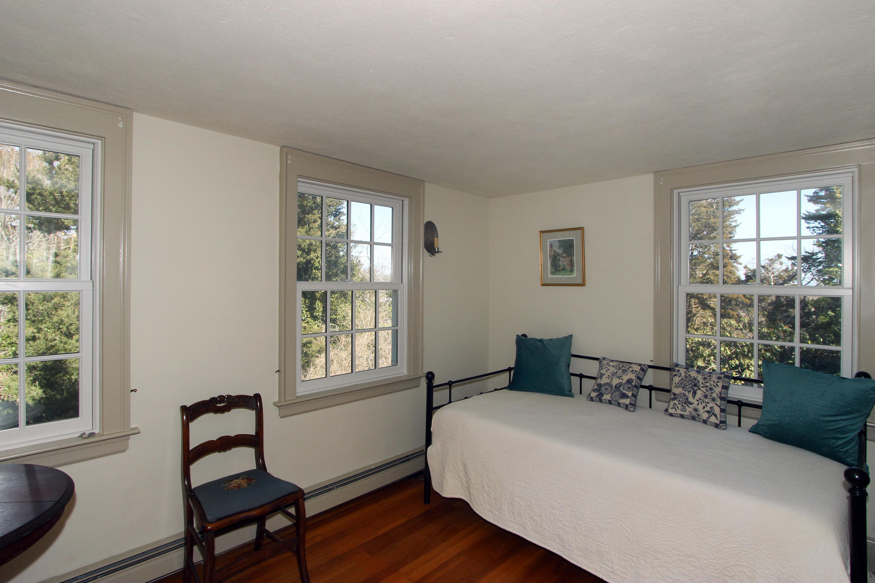 163 Pochet Road Orleans, MA 02653 - Photo 40 of 67 a bedroom with a bed chair and window