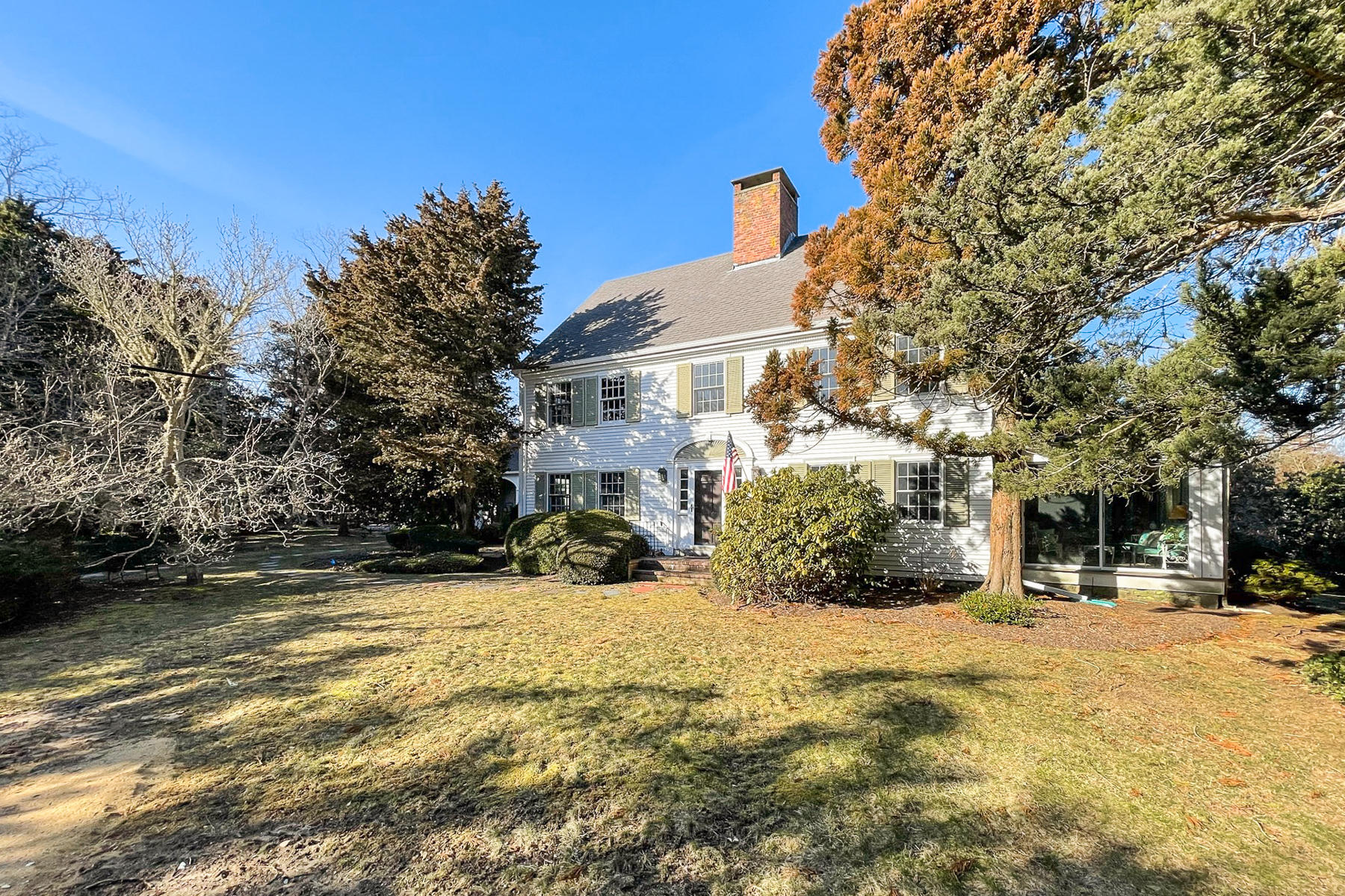 163 Pochet Road Orleans, MA 02653 - Photo 6 of 67 a view of a building with snow on the road