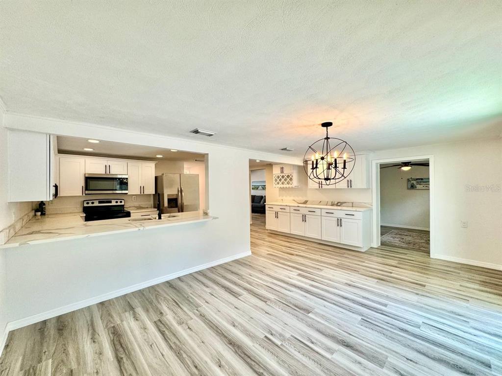 4282 Rudder Way New Port Richey, FL 34652 - Photo 26 of 34 a view of a kitchen with a sink and a stove top oven