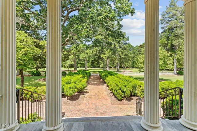a living room with furniture fireplace and a table