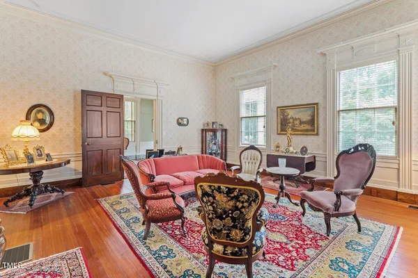 a view of a dining room with furniture window and wooden floor