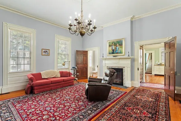 a spacious bedroom with a bed and a window