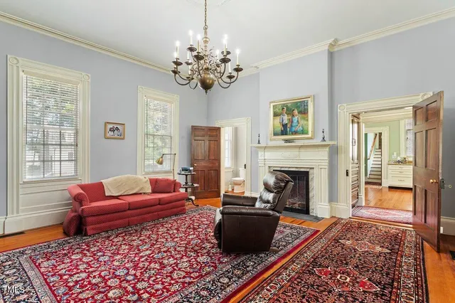 a spacious bedroom with a bed and a window