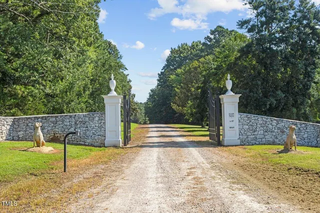 a view of a backyard with swimming pool