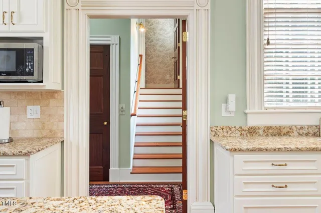 a bathroom with a sink a toilet and shower curtain