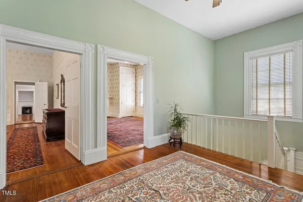 a view of a dining room with furniture and window