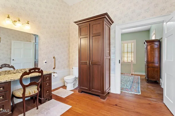 a view of a hallway with furniture