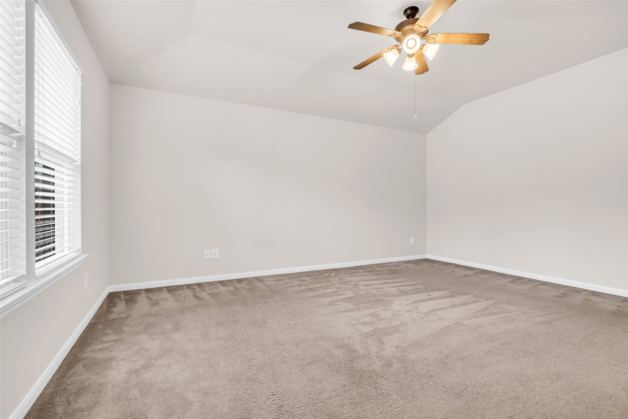 3311 Falcon Trail Drive Spring, TX 77373 - Photo 21 of 36 The primary suite is located to the rear of the home, just off the family room. This spacious room also features large windows, a walk-in close, and en suite bath.