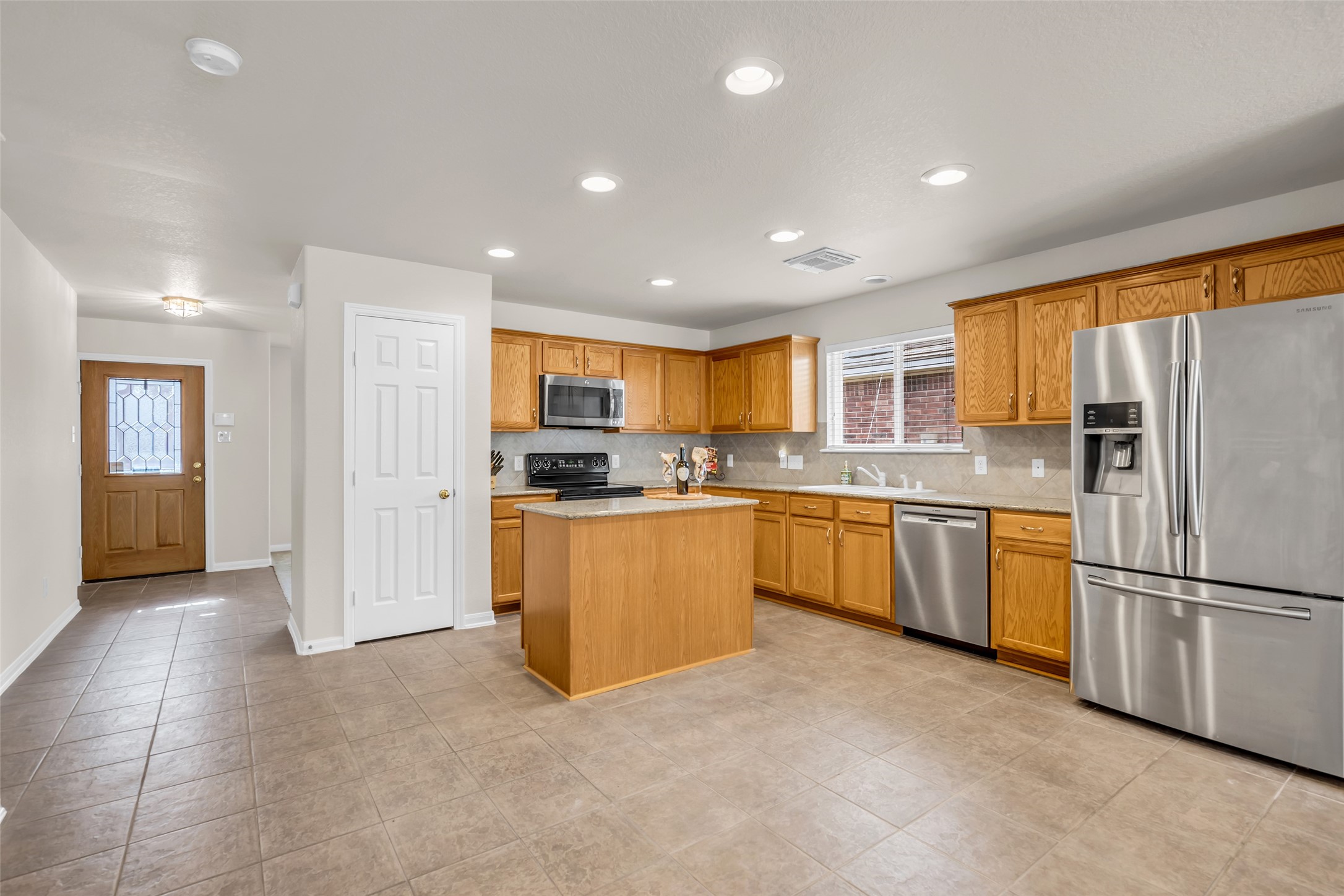 3311 Falcon Trail Drive Spring, TX 77373 - Photo 7 of 36 The island kitchen provides functionality and is open to the family room so that all can gather together!