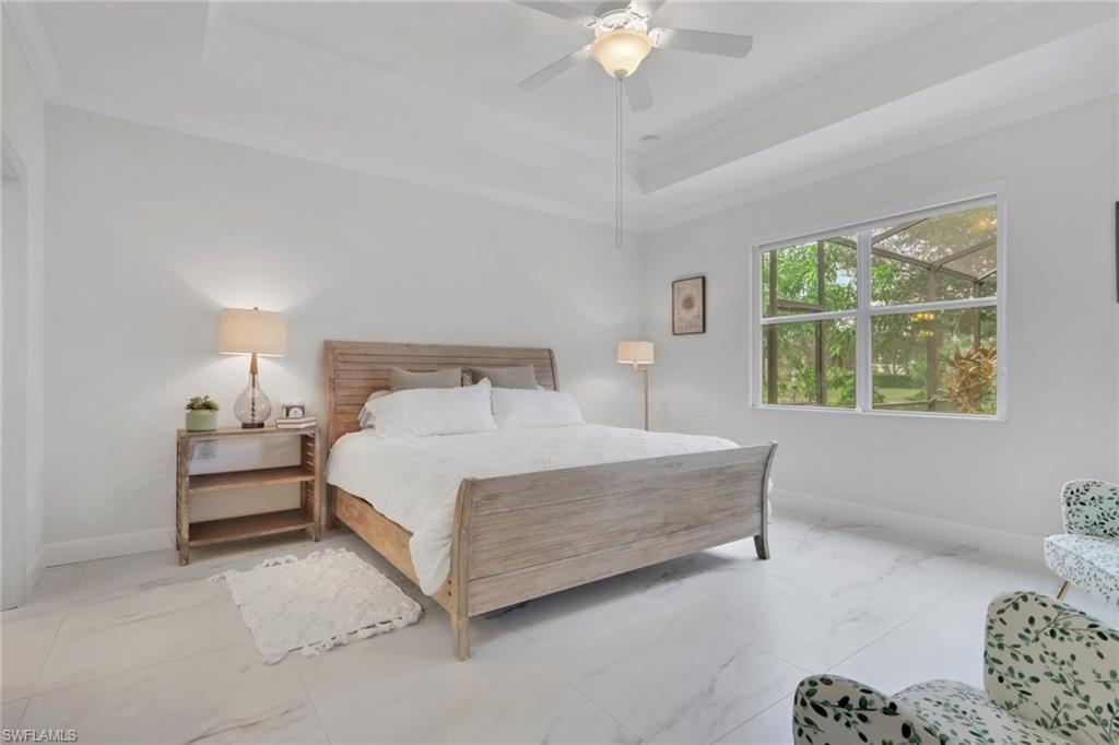 2045 Mandarin Lane Naples, FL 34120 - Photo 21 of 34 a bedroom with a bed and a window