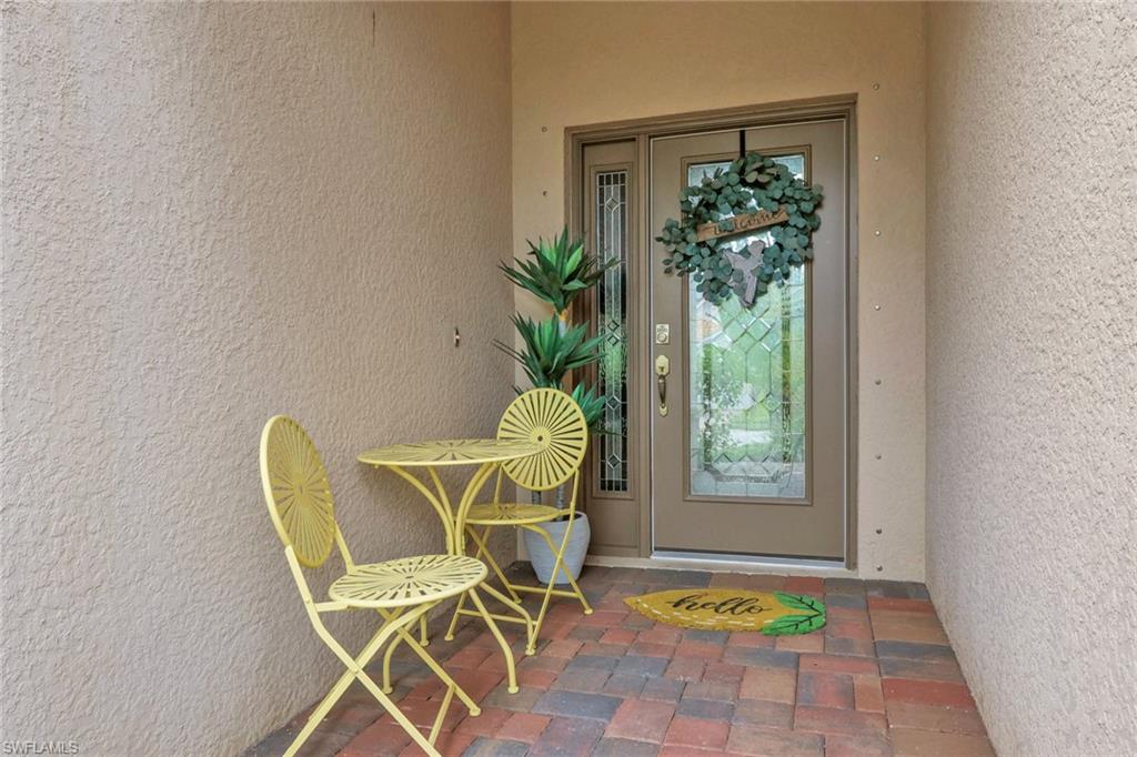 2045 Mandarin Lane Naples, FL 34120 - Photo 4 of 34 a view of a dining room with furniture window and front door
