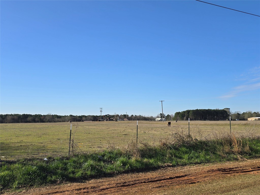 a view of a lake with houses in the background