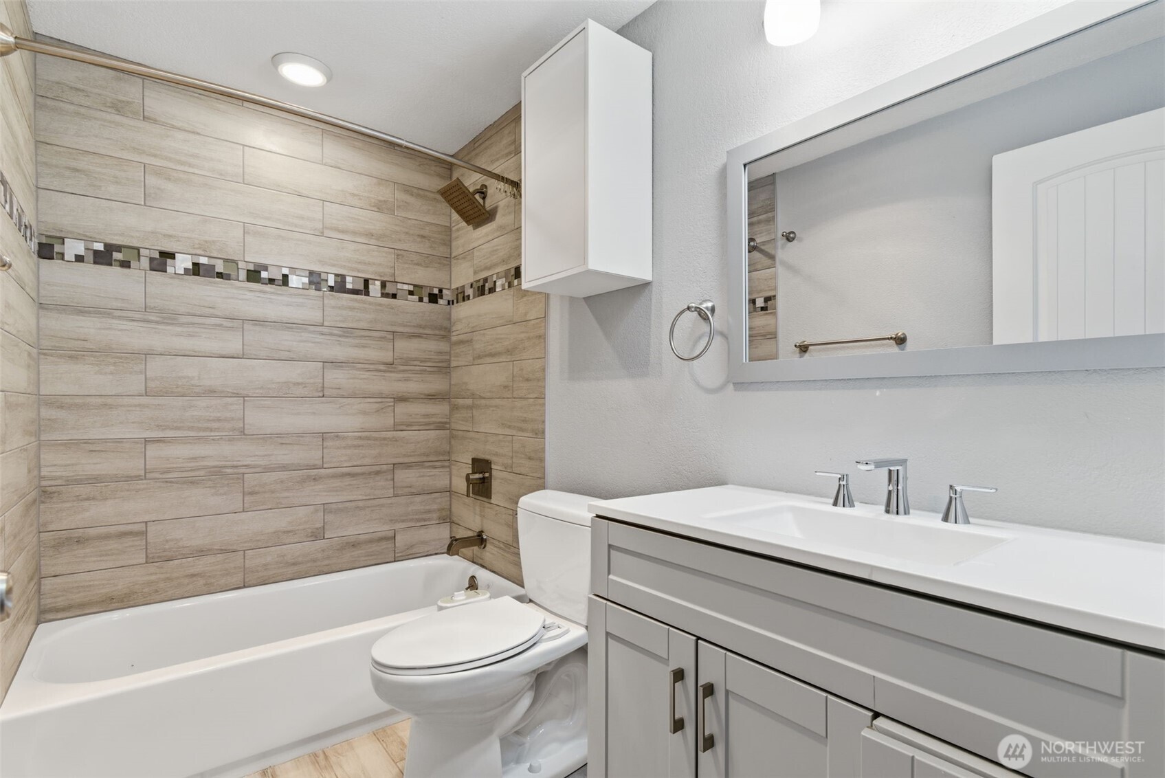 8621 25th Avenue Southwest, Unit B Seattle, WA 98106 - Photo 19 of 33 a bathroom with a sink a toilet and shower