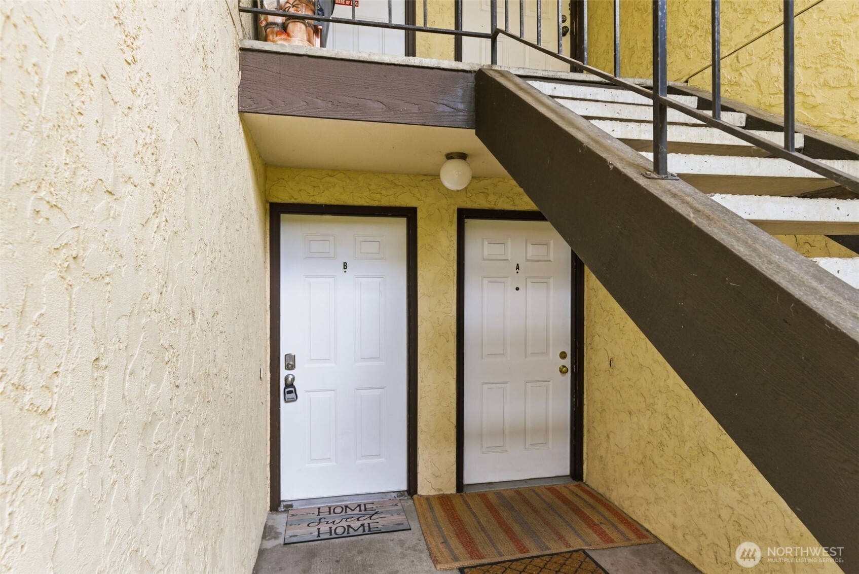 8621 25th Avenue Southwest, Unit B Seattle, WA 98106 - Photo 32 of 33 a view of a balcony with wooden floor and door
