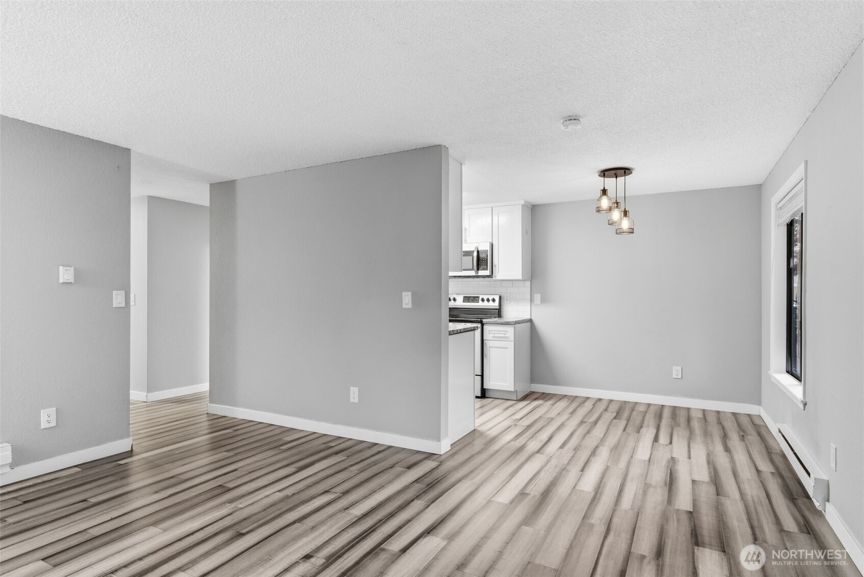 8621 25th Avenue Southwest, Unit B Seattle, WA 98106 - Photo 7 of 33 a view of empty room with wooden floor
