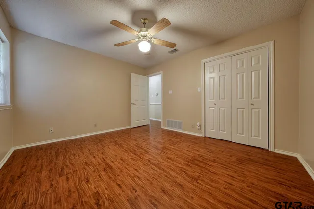 a bathroom with a double vanity sink toilet and shower