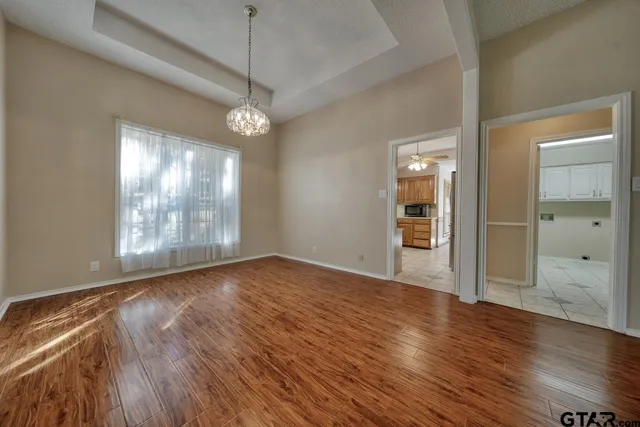 a view of livingroom with hardwood floor and a ceiling fan