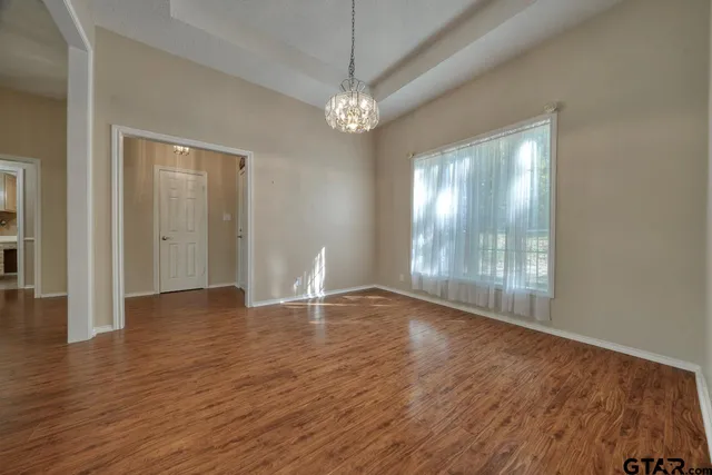 a kitchen with a sink window and cabinets