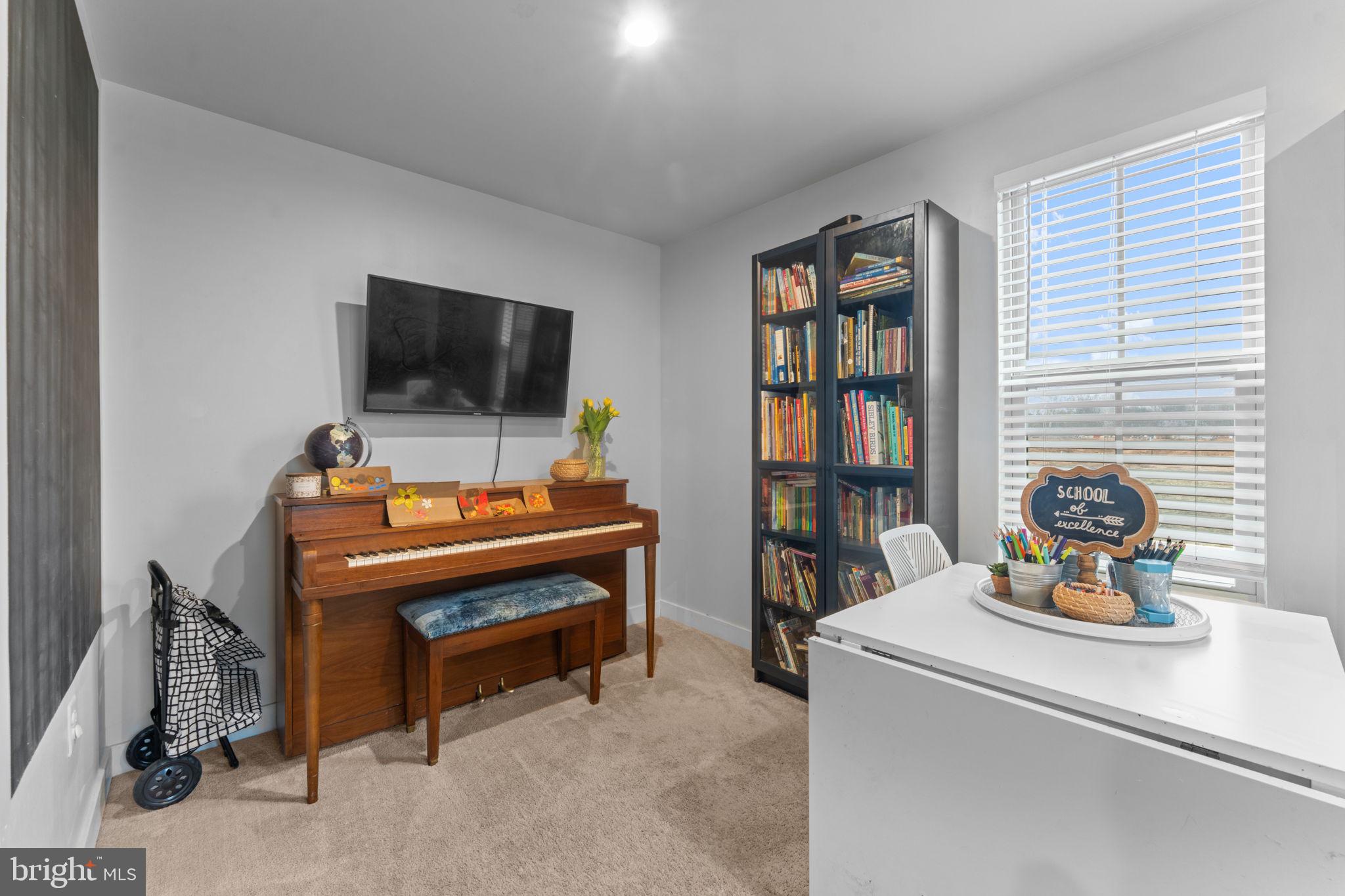 160 Lyons Creek Drive Laurel, MD 20708 - Photo 12 of 88 a living room with furniture and a flat screen tv