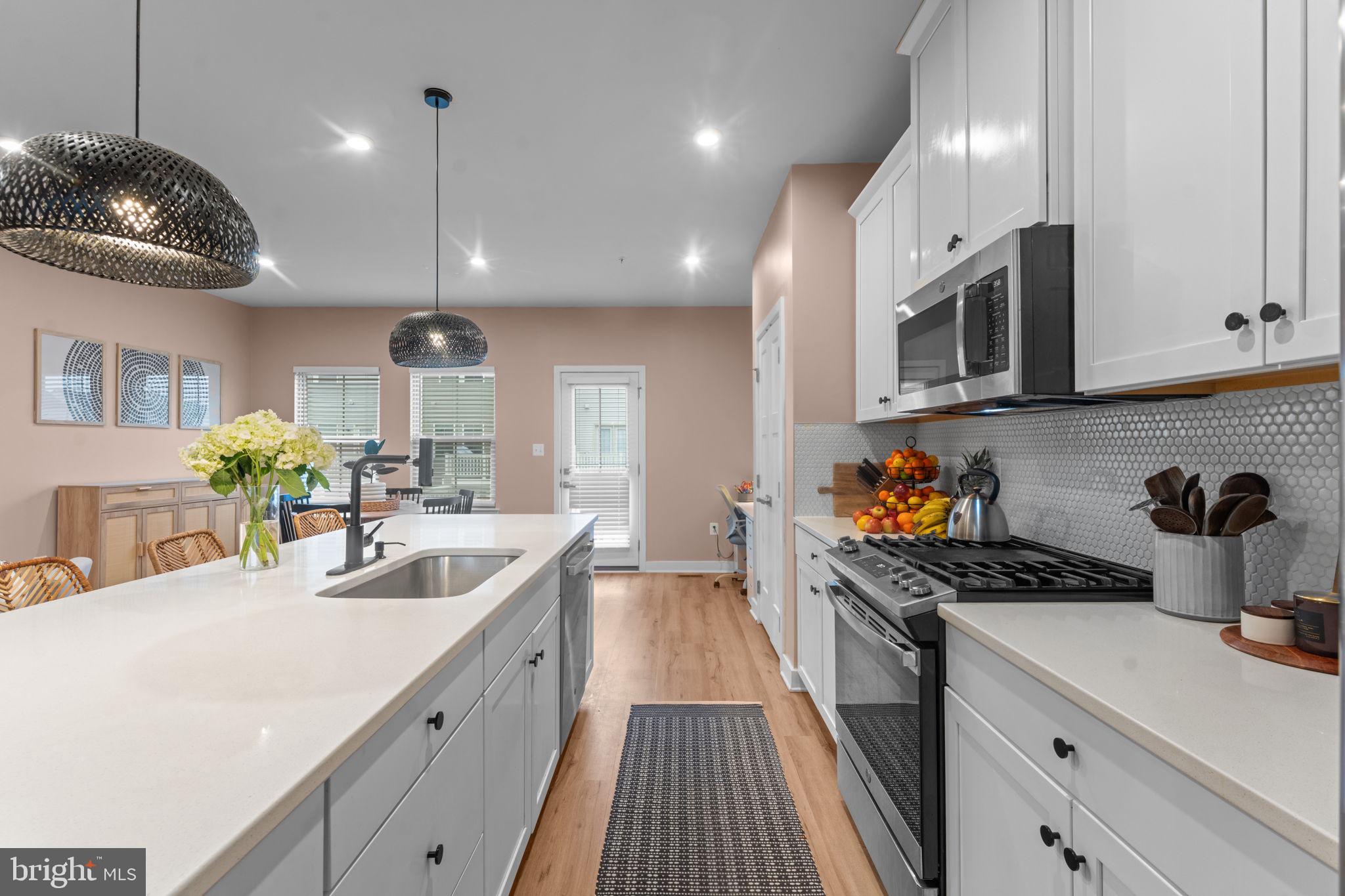 160 Lyons Creek Drive Laurel, MD 20708 - Photo 25 of 88 a kitchen with a sink stainless steel appliances a counter space cabinets and a counter top space